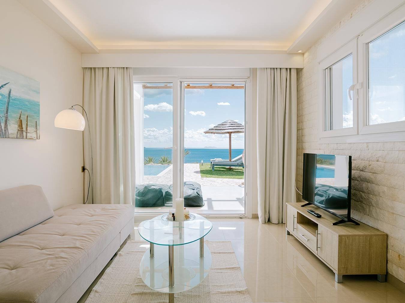 Villa Afrodite living room with TV and sea view