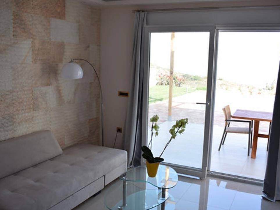 Villa Apollon living room with garden access
