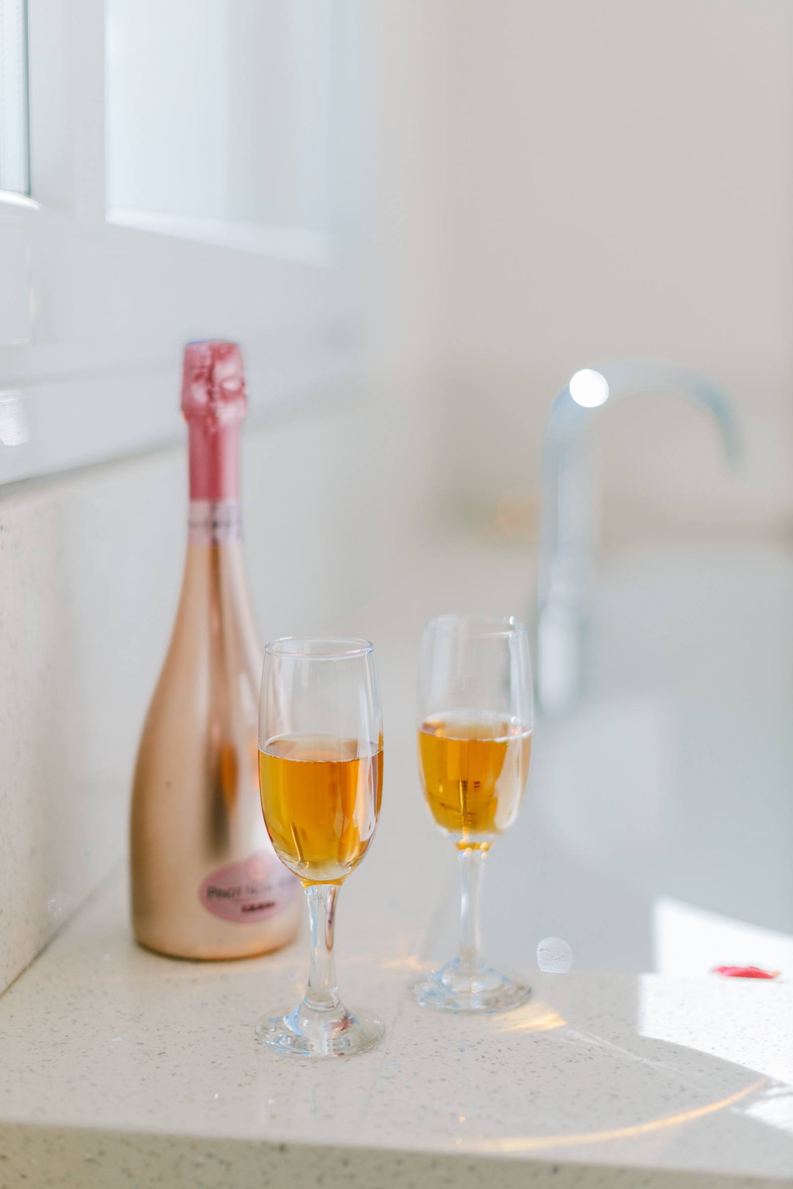 Prosecco and glasses by the jacuzzi