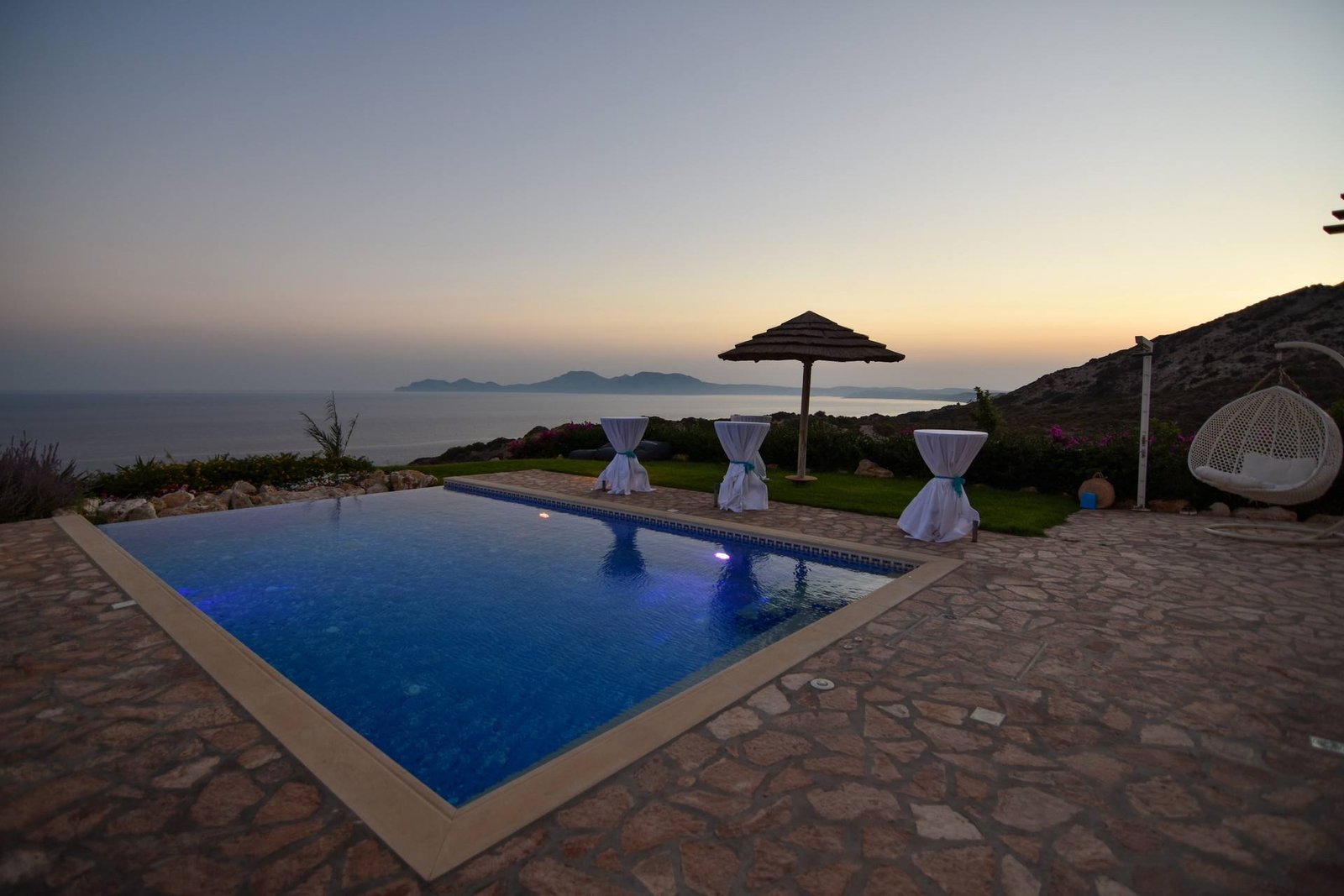 Pool and event set-up at sunset, Three Graces Villas
