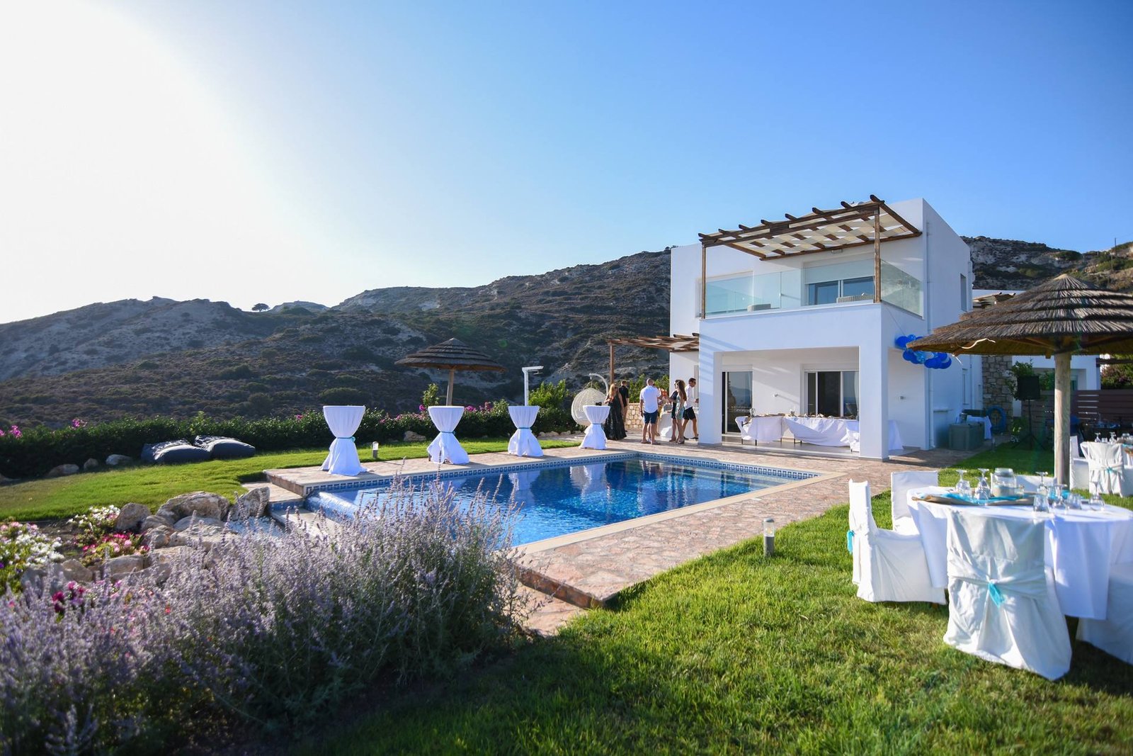 Villa, pool and lawn set for a celebration